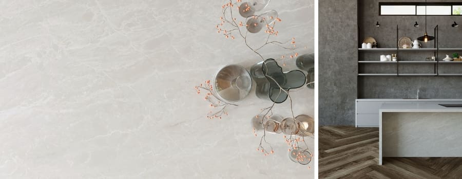 Cassandra Quartz countertop detail with subtle golden veining, styled with glass décor, paired with a sleek minimalist kitchen featuring open shelving and a waterfall island.