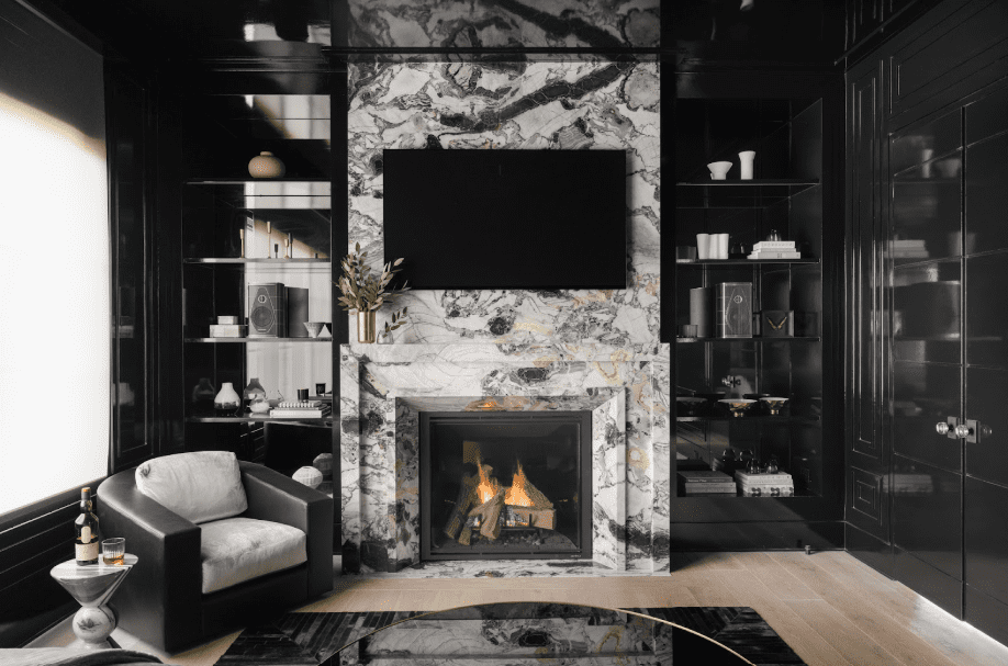 An image of a beautiful white and black marble fireplace in a living room. 