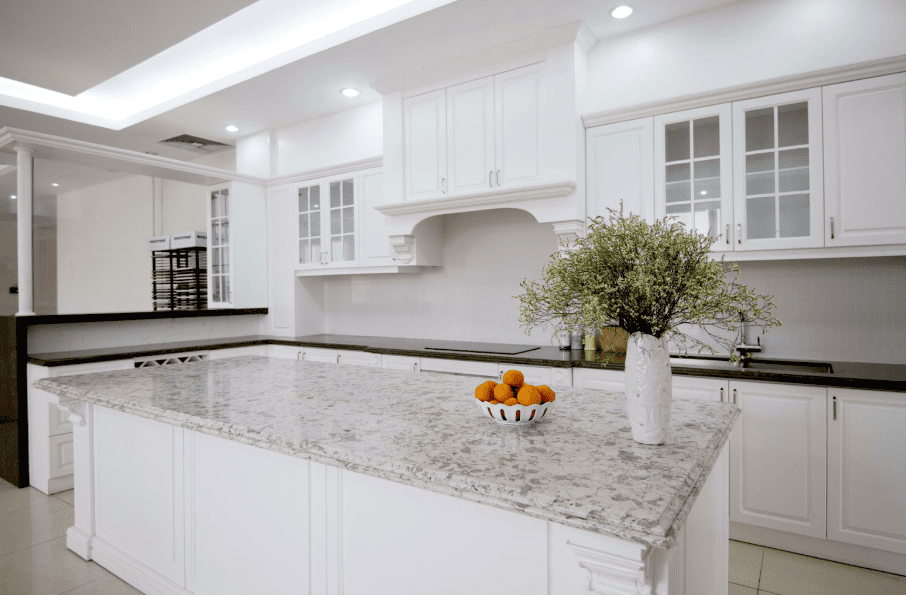 Vicostone Quartz in Alaska White, Pompeii Quartz in Milky Way in a contemporary kitchen with white cabinets. 