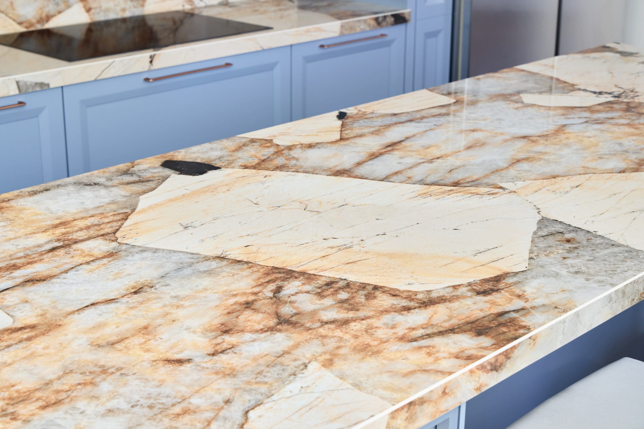 Striking Patagonia granite kitchen countertop with blue countertops.