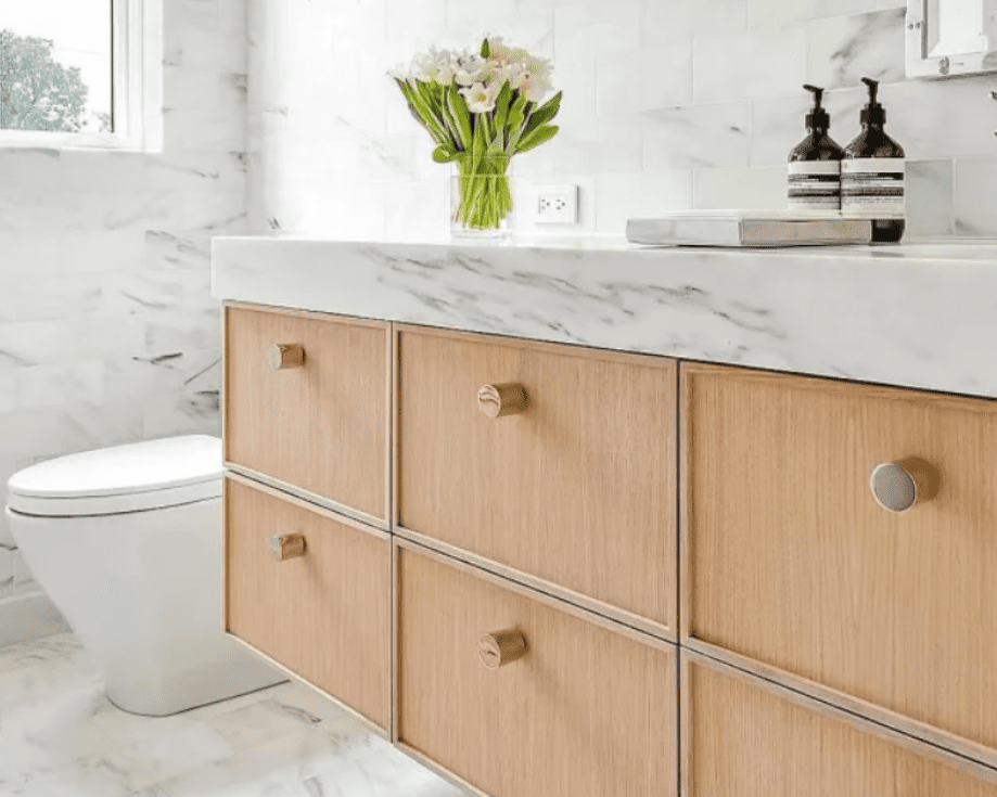 A Danby Marble countertop adds timeless charm to a half bathroom.