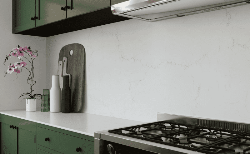 Kitchen backsplash featuring Pompeii Quartz Misterio Gold/ Vicostone Quartz Misterio Gold, illustrating natural stone vs quartz design appeal.
