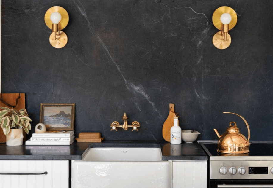 Black soapstone backsplash and countertop highlighting classic soapstone countertops.