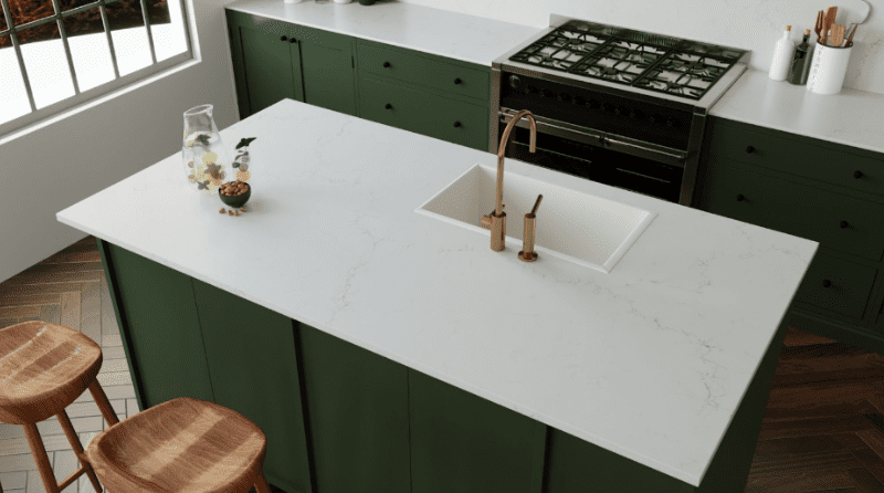 Modern kitchen island with Pompeii Quartz Misterio Gold/ Vicostone Quartz Misterio Gold countertop, highlighting that quartz is non porous and stain resistant.
