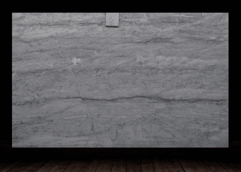 Gray quartzite slab with soft horizontal veining displayed against a dark backdrop.