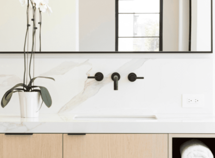 An image Infinity porcelain bathroom countertop in Calacatta Oro.
