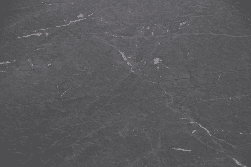 Up close image of a dark-toned soapstone slab.