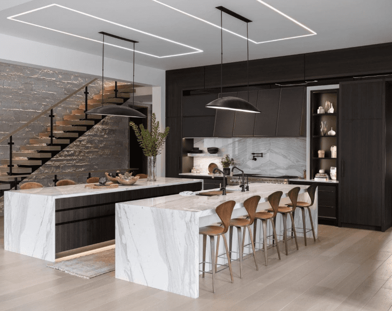 Modern kitchen with Calacatta marble countertops and island in a contemporary interior.