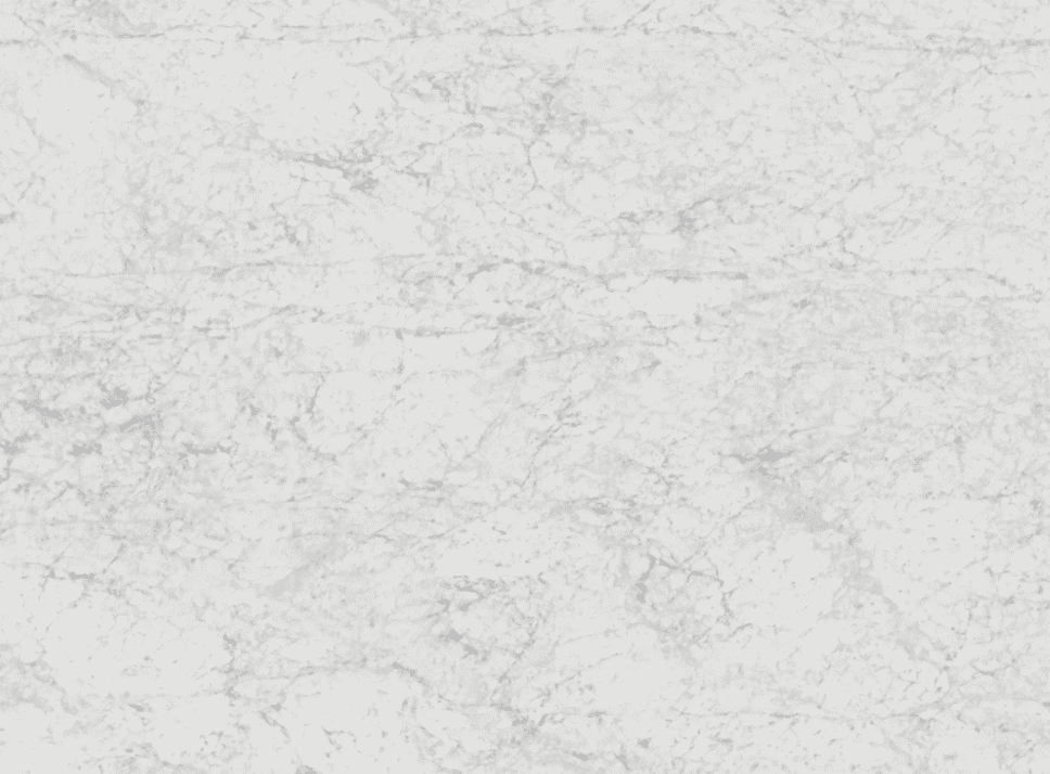 Carrara marble surface with fine gray veining on a white background.