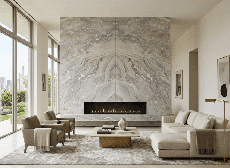 Floor-to-ceiling bookmatched Dolce Vita Dolomitestone feature wall with linear fireplace in a contemporary living room.