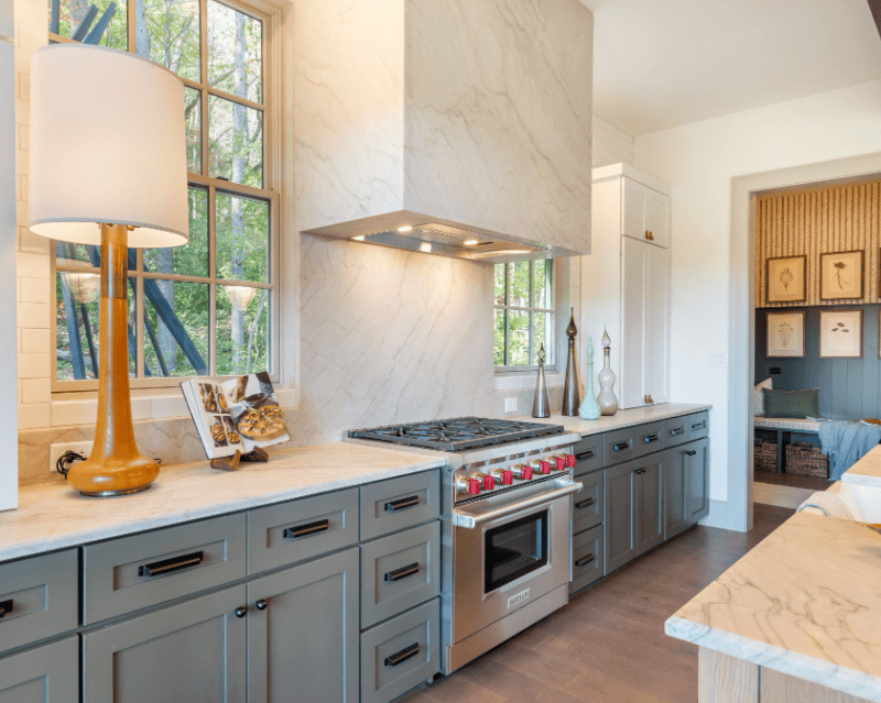 Magnolia quartzite countertops with soft gray veining in a bright modern kitchen.