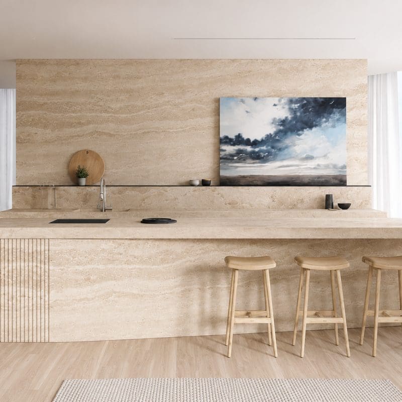 Travertine stone island and backsplash in a minimalist kitchen.