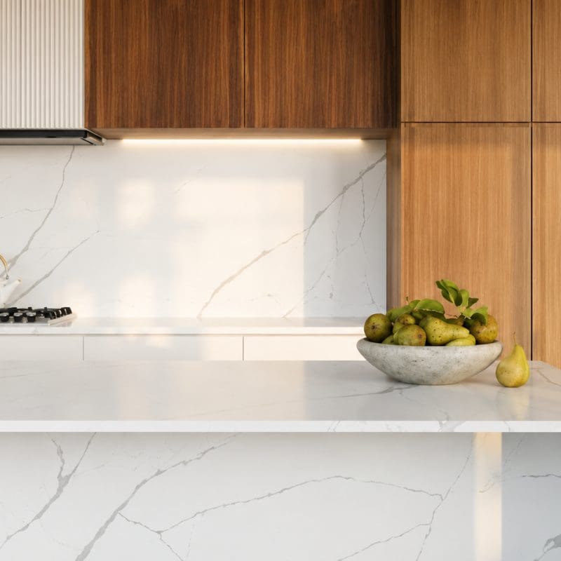 Modern kitchen featuring Calacatta Estremo quartz countertops, backsplash, and waterfall island.